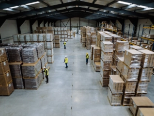 Workers in warehouse with packages