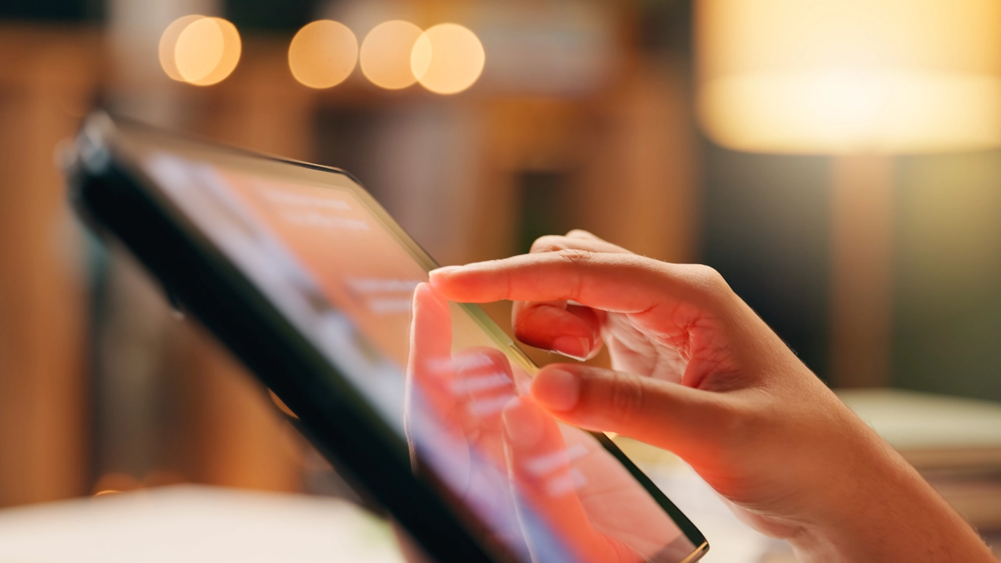Hand touching tablet image