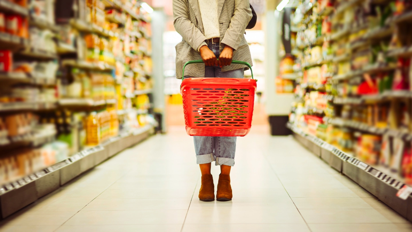 Supermarket shopper with basket image