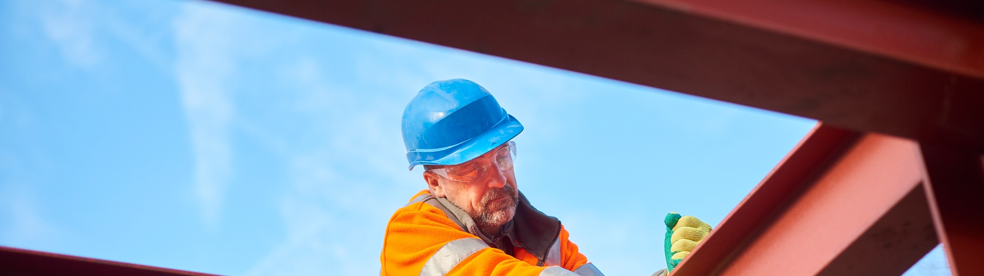 construction worker erecting girders